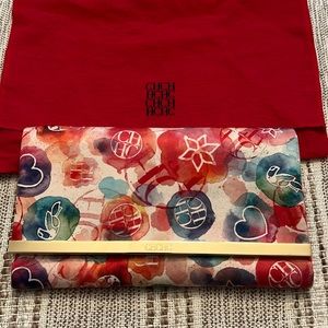 Authentic Carolina Herrera Satin Clutch with bag and tags.